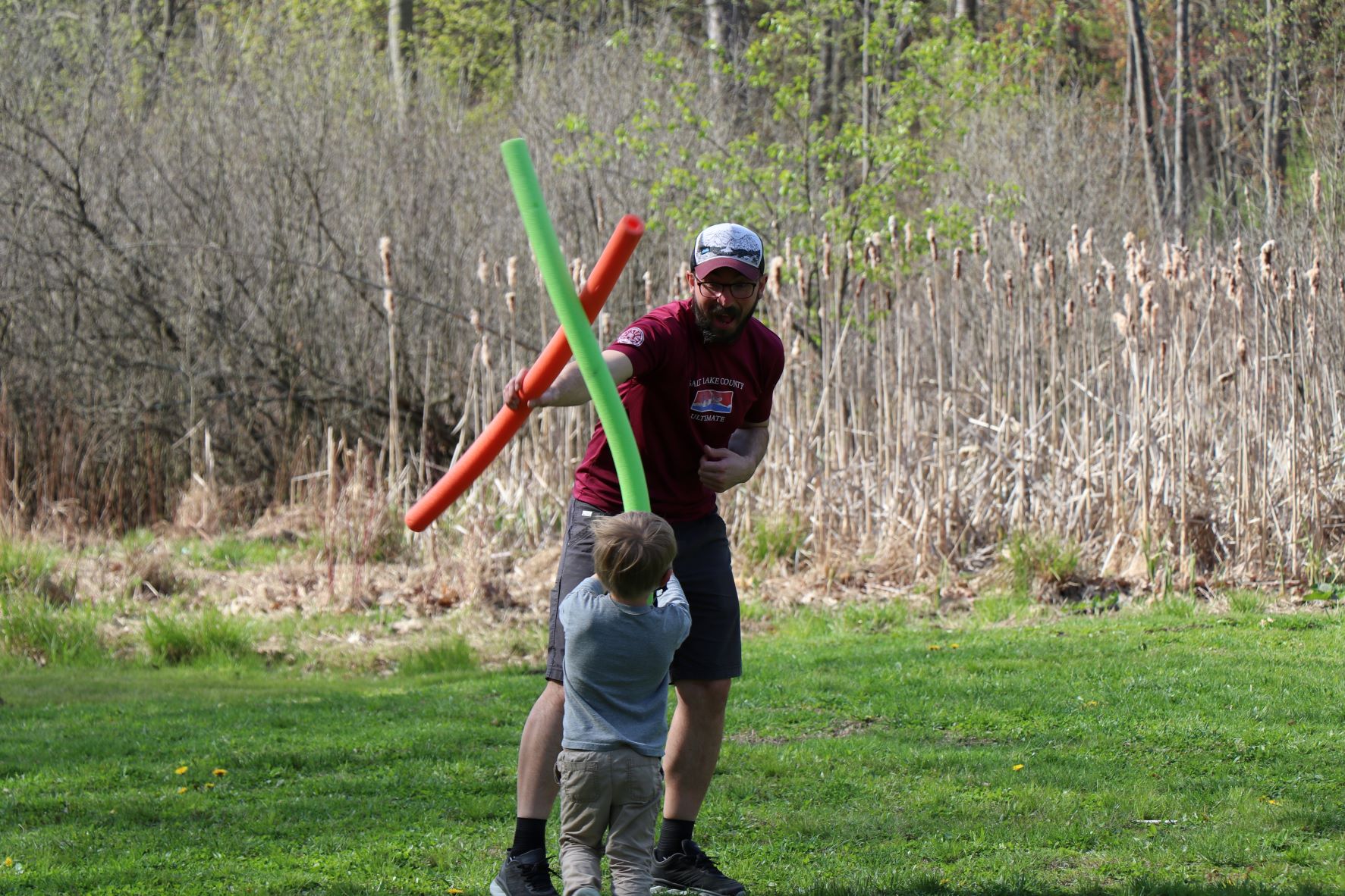 Dad and child playing a game at Dad & Me Weekend