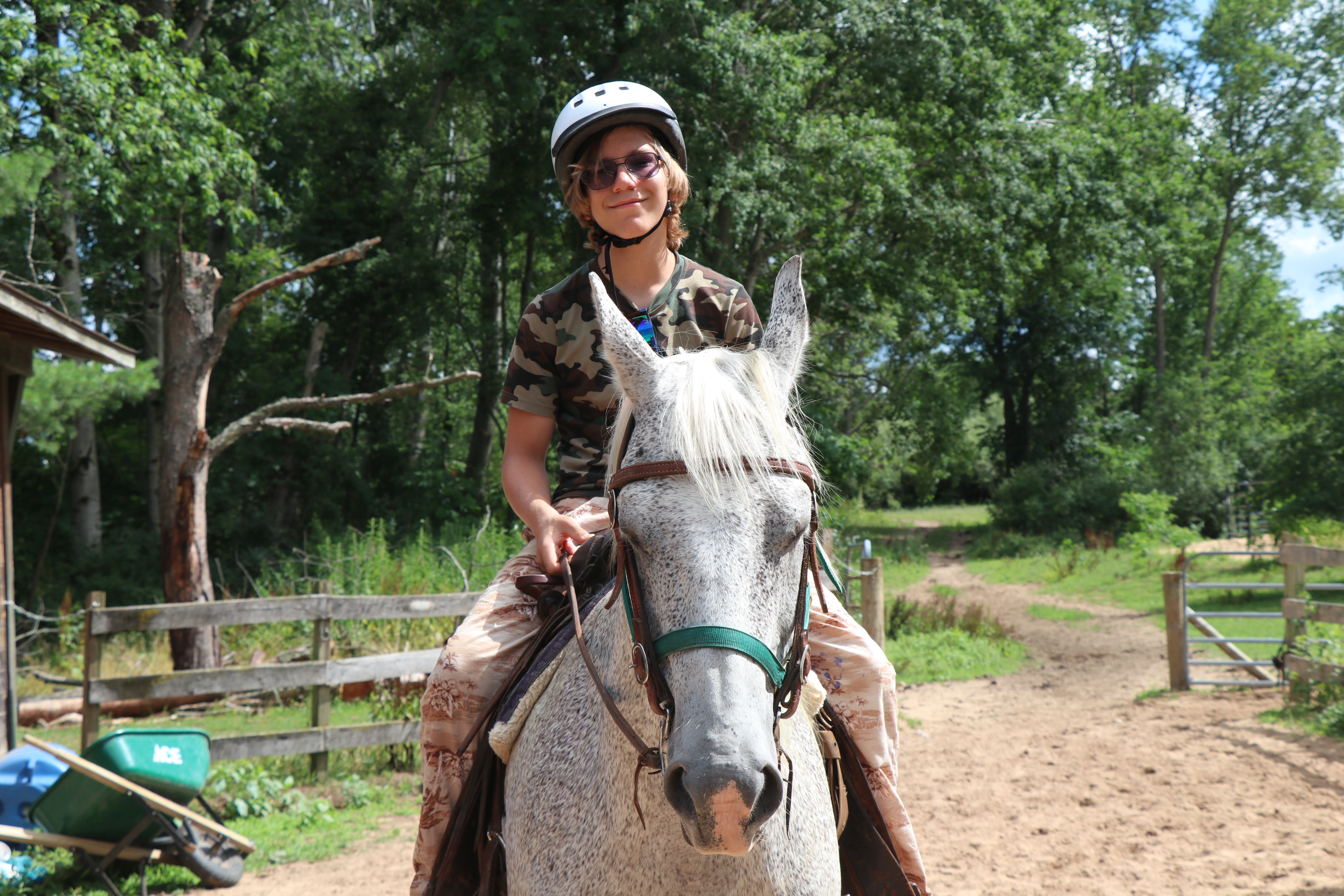 Boy riding a horse at Camp Henry