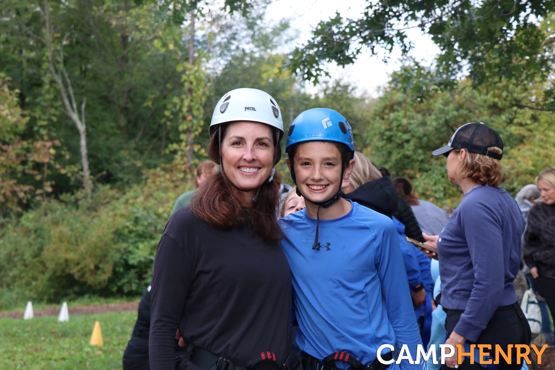 Mom and son smiling before going on the Giant Swing at Camp Henry