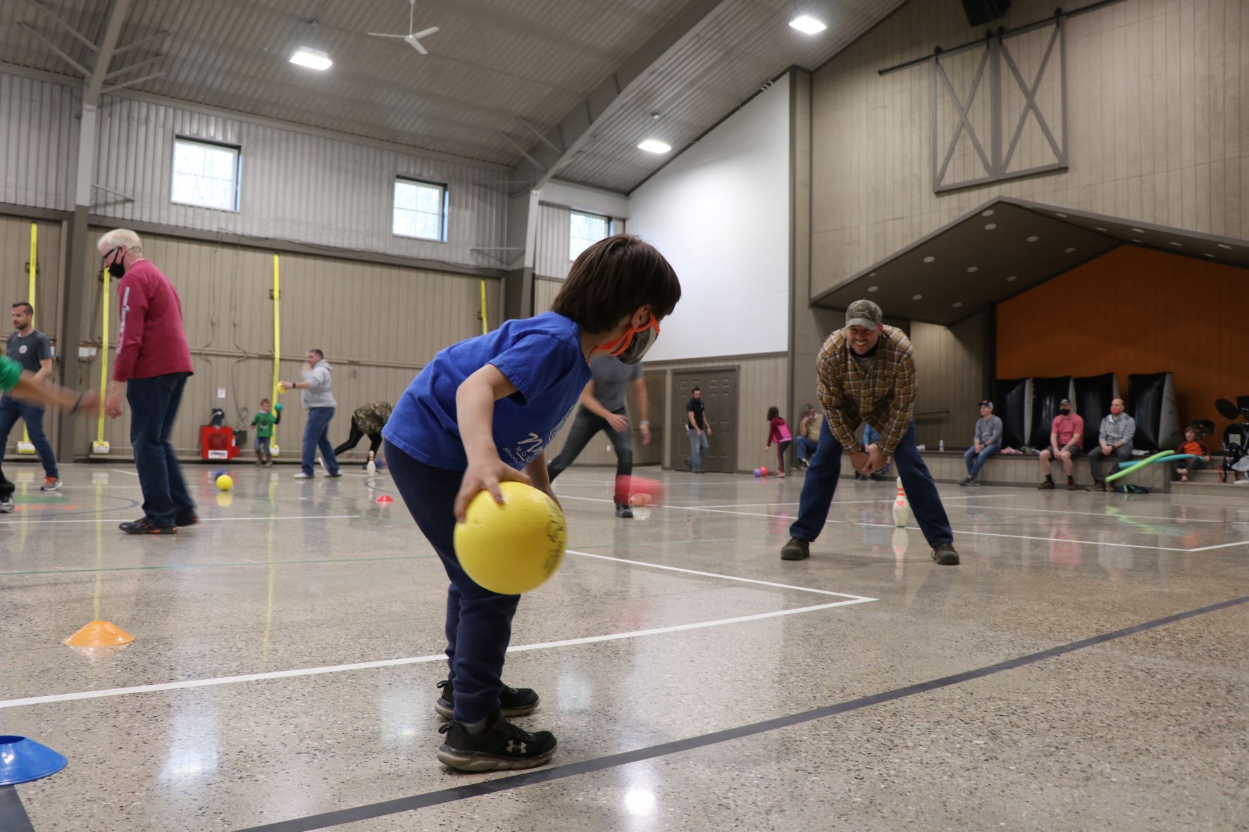 Dad and son playing a game in the Rec Pavilion 