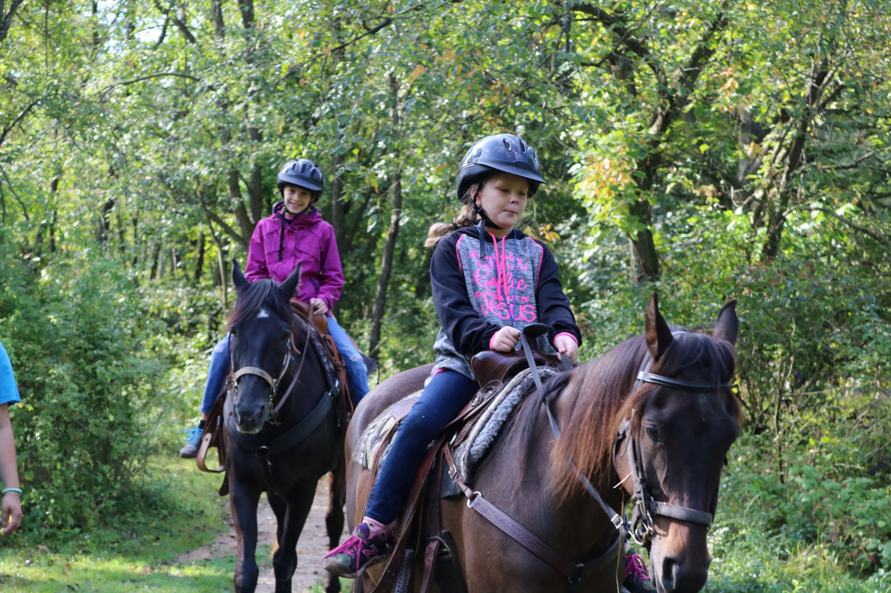 Girl Scout riding a horse